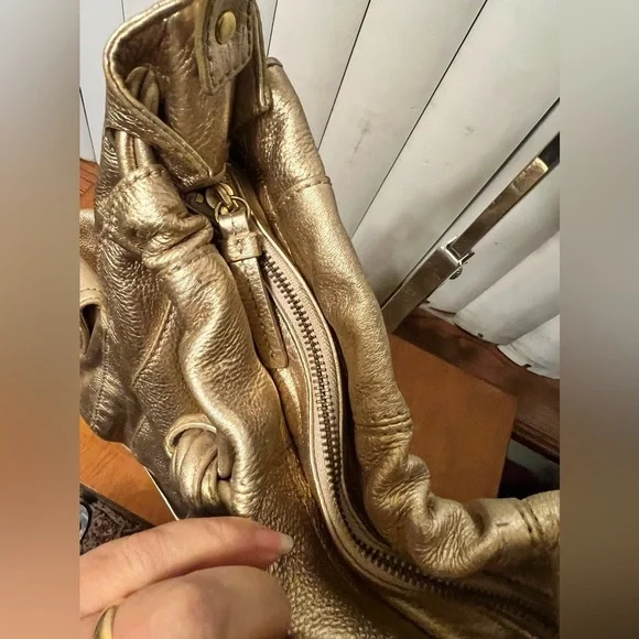 Michael Kors Metallic Gold Leather Drawstring Shoulder Bag. - Picture 16 of 16